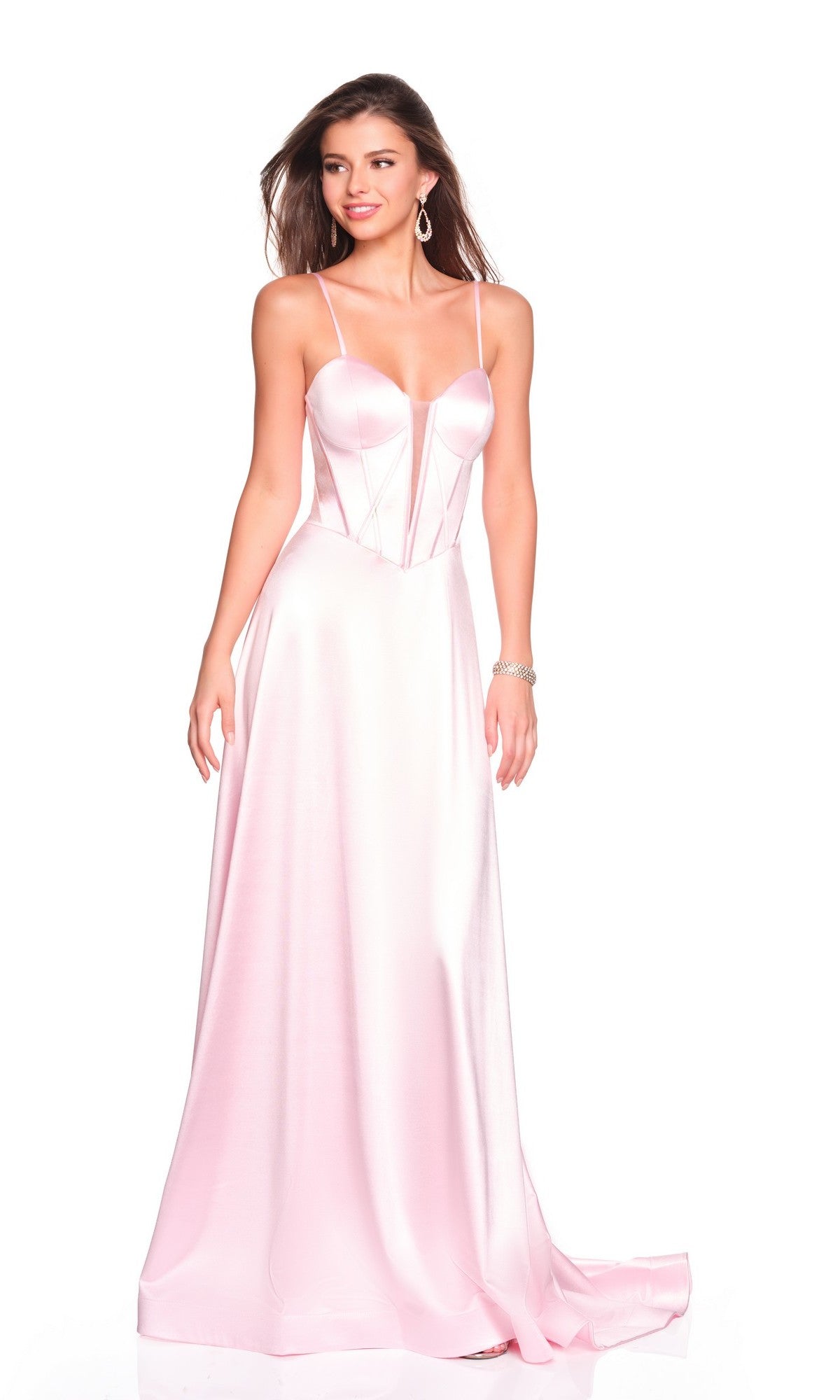 A woman wears the Dave and Johnny 12534 long prom dress, featuring light pink satin, thin straps, and a fitted corset bodice, standing against a white background.